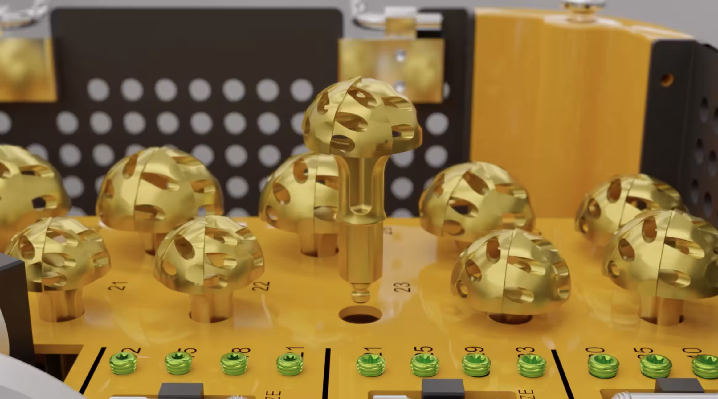 Close-up of gold-colored orthopedic reaming or milling instruments arranged in a yellow surgical tray.